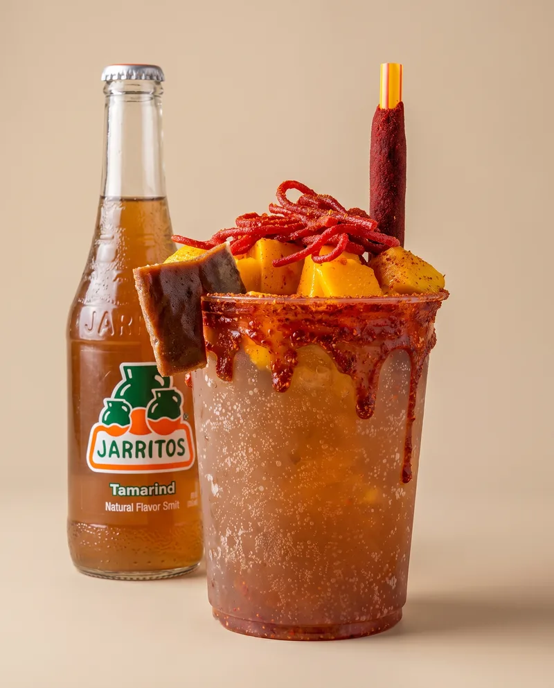 Poloco prepared tamarind Jarritos with chamoy and hot chips